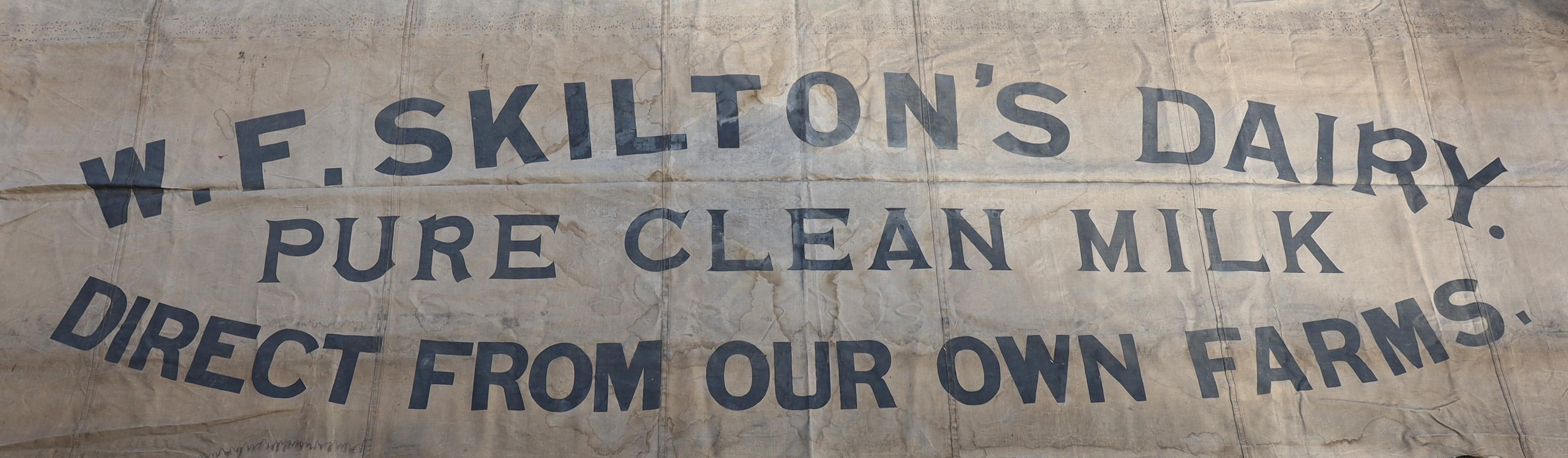 An early 20th Century Skilton Dairy canvas shop sign (van not included!)